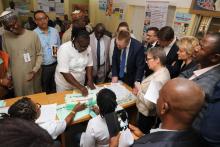 The head Matron showing delegates the immunization processes