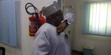 Borno State Commissioner for Health demonstrating coughing etiquette at press briefing. Photo_WHO_C. Onuekwe
