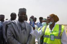 Deputy Governor Usman Kadafur being screened for temperature by Port Health services at the Maiduguri International Airport_Photo_WHO_C.Onuekwe