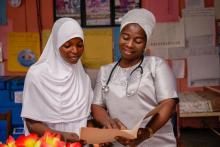 Female health workers going through a medical report in a Primary Health Care Center, Ibadan