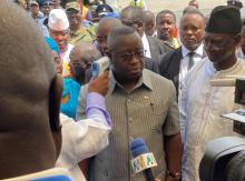 H.E President Julius Maada Bio having his temperature checked at the Freetown International Airport during one of his readiness assessment