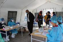 Representante da OMS acompanha o Senhor Ministro da Saúde e da Segurança Social numa visita às tendas de testagem ràpida de COVID-19 