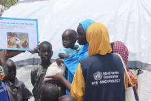 WHO health mobile teams providing health education to household members on cholera prevention in Muna IDPs camp, Borno state 
