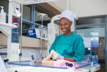 A healthCare worker attending a new born in Kirehe District Hospital, Eastern Province
