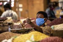 A woman selling beans at Nyabugogo market in City of Kigali after lockdown