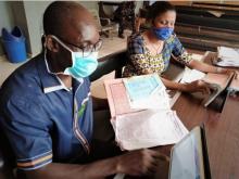 Medical Record Officers extracting data from case folders into web- based platform.v3.jpg