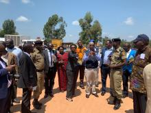 The Minister of Health Dr Jane Ruth Aceng (center in black) accompanied by Yonas Tegegn Woldermariam inspecting Ebola Virus Disease preparation and response work at Mpondwe Immigration point on the border with the Democratic Republic of Congo in 2019. 