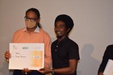 Hon. Mr S. Toussaint and the Winner of the National  Info Clip Competition - category 2
