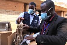 Louis Mukumba receiving office equipment on behalf of City of Harare 