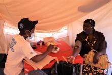 Garikai Camp Resident getting attended to in the mobile clinic consultation tent 
