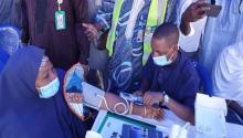 Permanent Secretary Kano State Ministry of Health Checking her blood pressure during the launch of NHCI in Kano State.