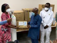 Dr Sally Ann Ohene (DPC Officer) making the presentation to the Hon Minister for Health, Mr Kwaku Agyeman- Manu