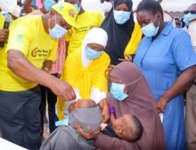 Dr Colonel Francis Kuria, MOH, vaccinates a child at the national polio launch in Garissa county, ahead of the May 22-26 campaign in 13 counties at risk