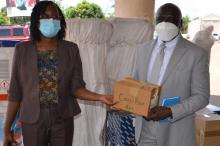 Dr. Peter Clement, WR-Liberia handing over donated supplies to the Honorable Minister of Health Dr. Wilhelmina Jallah