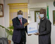 WR making a presentation to the Minister of FCT