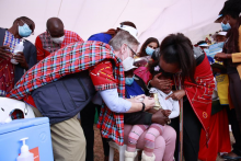Dr Rudi Eggers, WR Kenya, vaccinates a child at the launch of measles rubella campaign in Kenya
