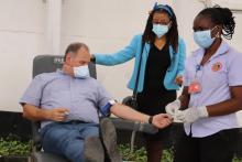 The UN Resident Coordinator, Mr. Zlatan Milisic giving the gift of blood. Dr. Tigest Ketsela, WHO Representative witnessing the gesture during the WBDD 2021 commemorations