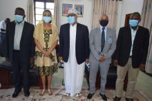 Dr. Tigest in a posed photo with the Honorable Minister of Health, Nassor Ahmed Mazrui, and his team