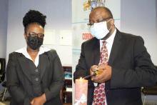 The Director of Health Services, Dr Vusi Magagula lighting a candle to mark the patient safety day commemoration