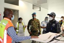 Obakeng Kgosiethata, Senior Health Officer giving details to Dr Raphael John Marfo about Sir Seretse Khama International Airport