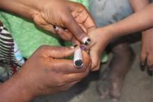 Finger marking, after administering the SMC drugs to an eligible child. Photo_credit_Kingsley-WHO