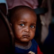 Child waiting to receive his routine immunization vaccines
