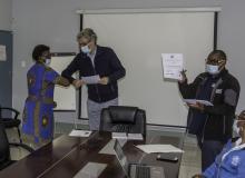 Dr Elias Pavopoulos handing out certificates to trainees following a training session