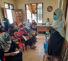 A health worker in Mombasa addresses members of Old Town community on Covid-19 prevention and protection in a Chief's baraza