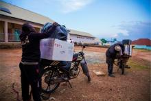 Health workers loading their bikes with vaccines for hard-to-reach settlements of Taraba.j