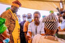 Osun Deputy Governor supervising vaccination of an elderly man