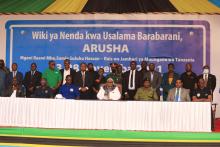 Government officials in a group photo with Her Excellency Samia Suluhu Hassan and delegates from the high table