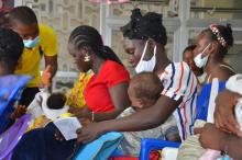 Mothers que up at JFK Medical Centre in Monrovia for routine immunisation at the under five clinic