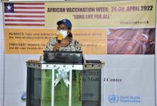 WHO Liberia Family and Reproductive Health cluster lead- Dr Musu Duworko reading the WHO African Regional Directors Message on African Vaccination Week  at the national launch