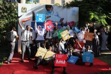 Students posing with the Sustainable Development Goals banners during the ceremony