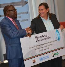 Mr Wilson Njenga, Principal Secretary, Interior Ministry shakes hands with Ms Kelly Larson, Bloomberg Philanthropies director