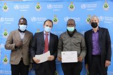  Dr Tapfumaneyi Mashe,  Dr Alessandro Patriarchi and Mr Paul Verboom handing over a certificate to one of the costing coordinators after the training 