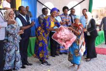 Older persons receiving a token of appreciation from the Minister of Community Development, Gender, Women and Special Groups, Dr. Dorothy Gwajima