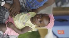 A child waiting to receive malaria vaccine at an outreach clinic