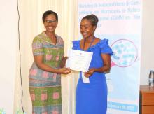 WHO Representative Dr. Françoise Bigirimana presenting a certificate to one of the participants