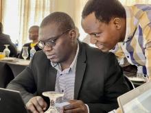 MoHCC, National TB/HIV Officer Dr Manners Ncube (right) and WHO Zimbabwe HIV and TB Technical Officer Dr Mkhokheli Ngwenya (left) during the Prevent TB Application training 