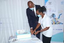 WHO representative and Mr Gareth Guadalupe, the Minister of the Presidency of the Council of Ministers and Parliamentary Affairs cutting the WHO anniversary cake