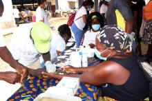 Community members receing free health services at BoBo Foro market