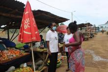 The WHO Representative, Dr. Françoise Bigirimana speaking to a community member who was receiving free health services