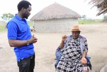 Mr. Mleli David, District Immunization and Vaccine Officer in Babati  with Mtisha, the community leader