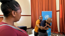 Basic Emergency Care facilitators demonstrating the Heimlich maneuver to relieve a choking patient during the Mahalapye district training in December 2022. 