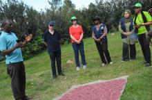 Farmer Joel  Omwoi speaks to WHO team at his farm in  Migori county