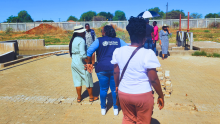 WHO officials and experts engaging in hands-on training for environmental surveillance, laying the foundation for the establishment of new ES sites in South Africa, as supported by the World Health Organization.