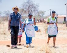 Health workers walking in villages