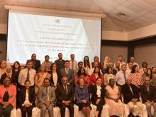 Participants pose for a group photo after the opening ceremony. 