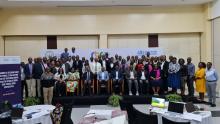 Delegates, external evaluators and participants posing for a group photo during the opening session of the JEE.